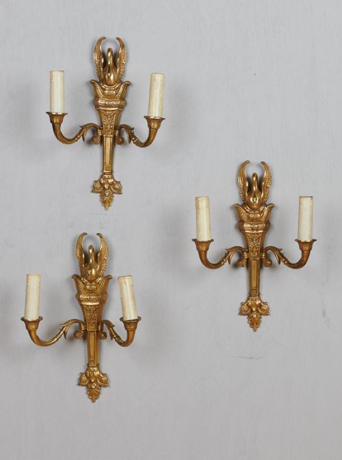 A Set of Three French Brass Wall Sconces with Decorative Swan Design