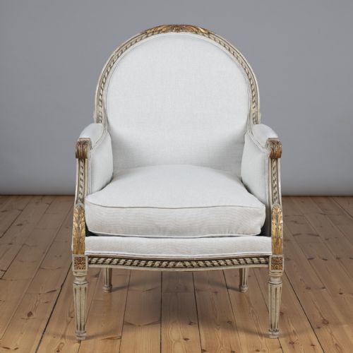 Late 19th Century French Louis Xvi Style Painted and Gilt Bergere Armchair.