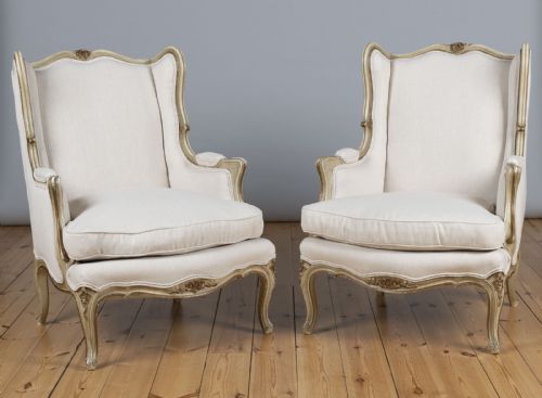 A Pair of Large French Gilt and Painted Upholstered Bergere Armchairs.