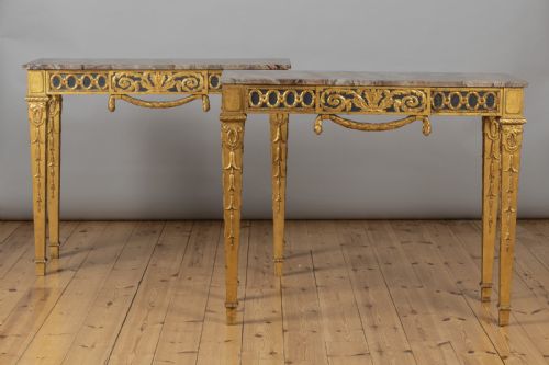A Stunning Pair of French Empire Style Gilt and Painted Console Tables.
