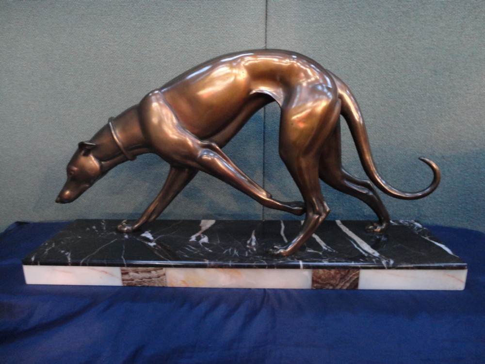 French Art Deco Spelter Dog Set On a Marble and Onyx Base. This piece is signed ROCHARD.