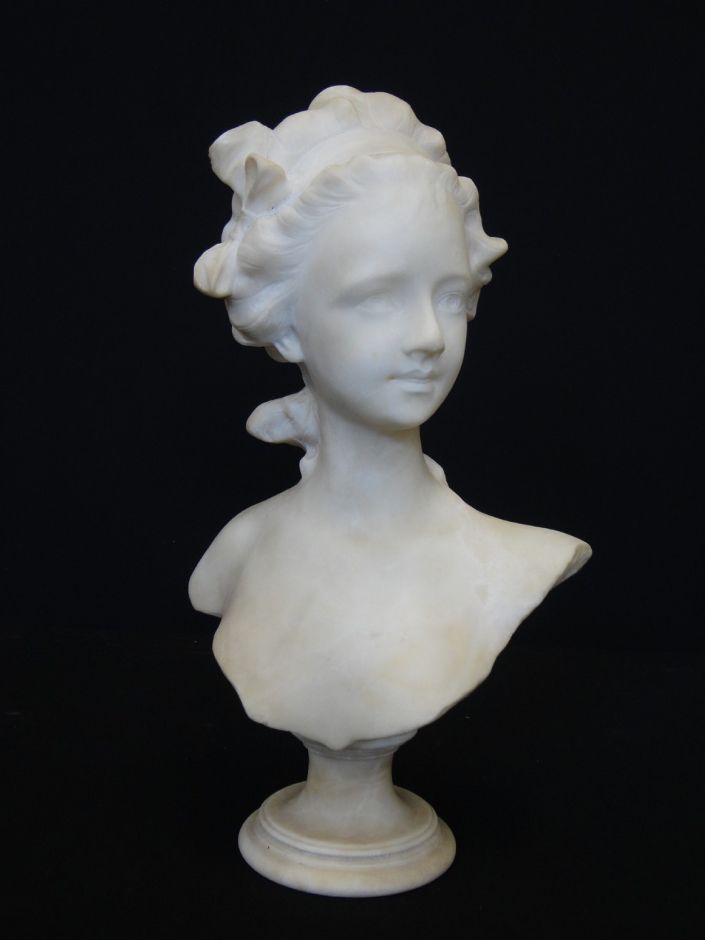 French Carved Alabaster Bust Of A Young Girl.
