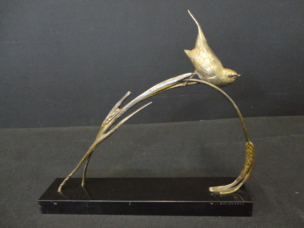 French Bronze Bird Set On A Black Marble Base.