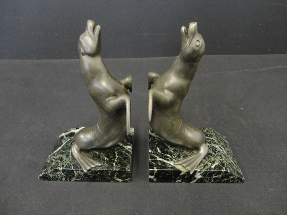 Pair Of Art Deco French Spelter Sea Lion Bookends Set On Verdi marble Base.