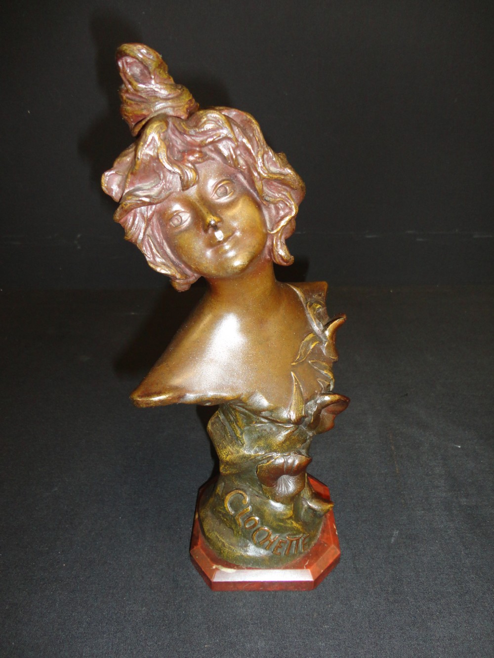 French Spelter Bust Of A Female Set on A Rouge Marble Base.