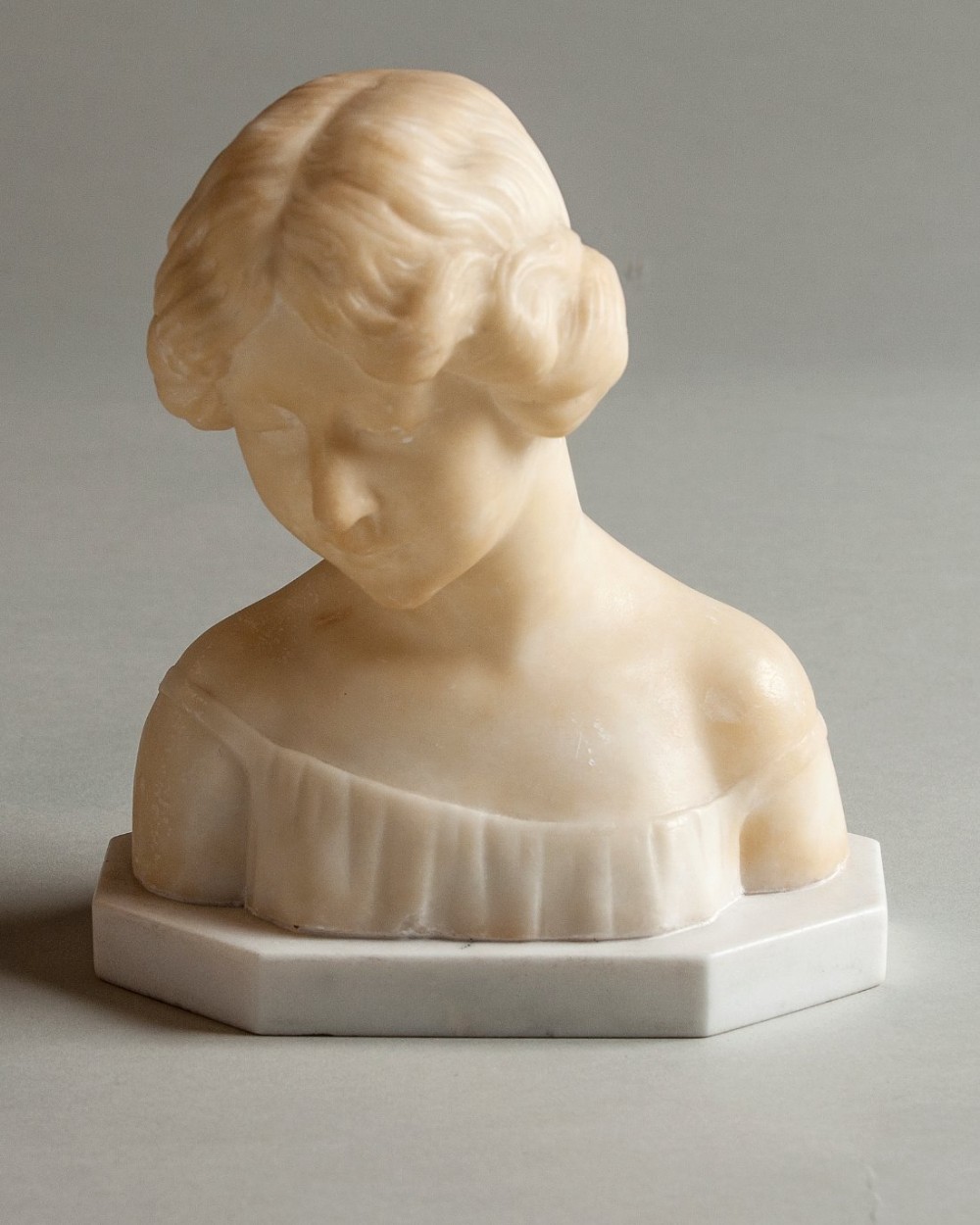 French carved alabaster and marble female sculpture