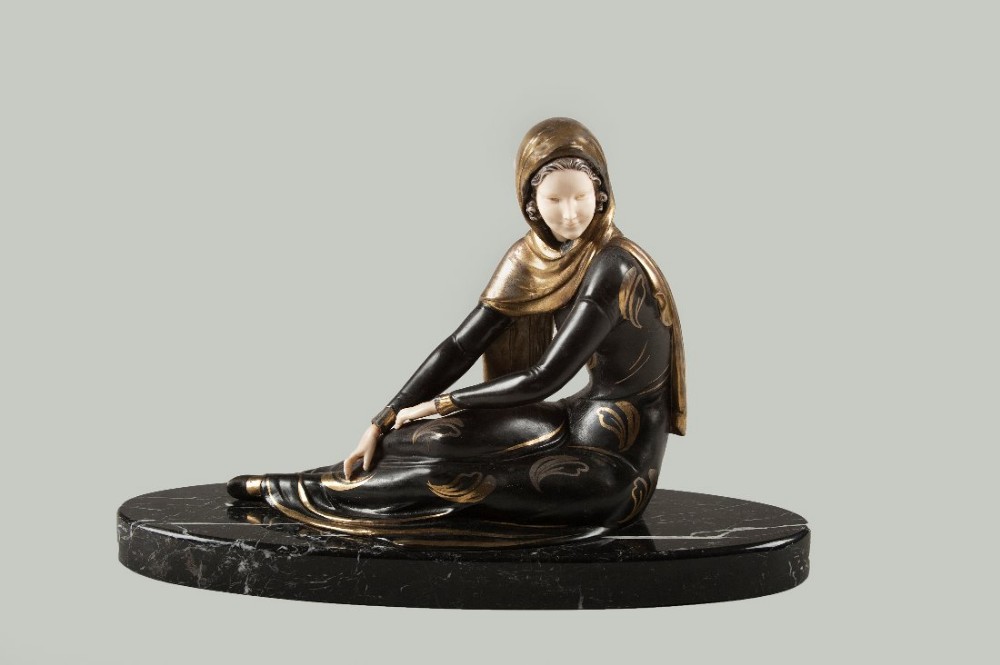 French Art Deco spelter and Ivorine sculpture set on a marble base