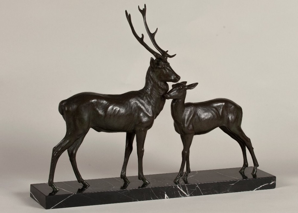 French Art Deco bronze sculpture of a stag and doe set on a Portoro marble base. Signed L.RICHE