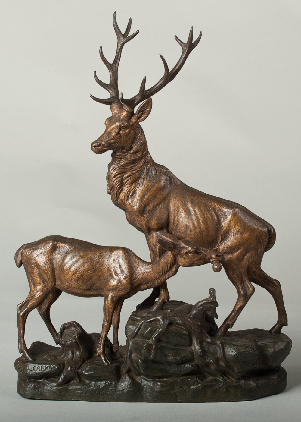 French Art Deco patinated spelter sculpture of a stag and doe by the artist L.Carvin