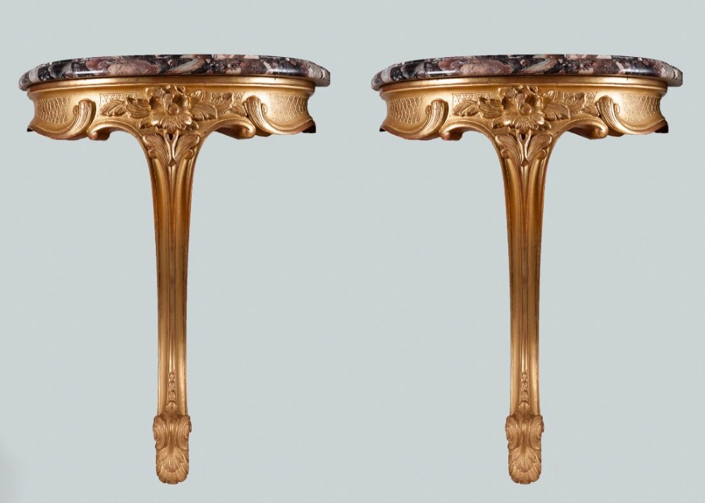 Pair of unusual French gilt wall bracket console tables with Breccia di Seravezza marble tops.