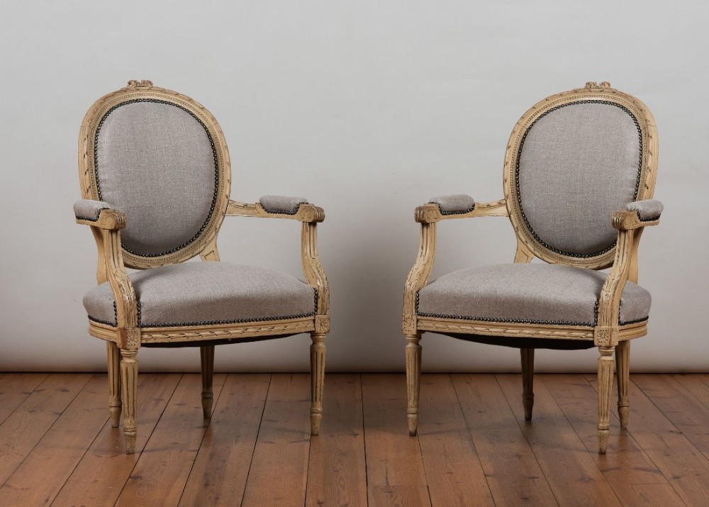 Pair of French, 19th Century original painted Armchairs, upholstered in a grey fabric.