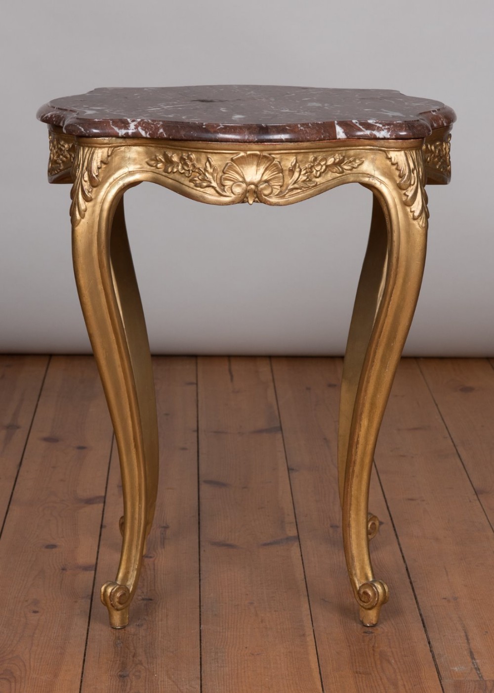 French gilt occasional table with a rouge marble