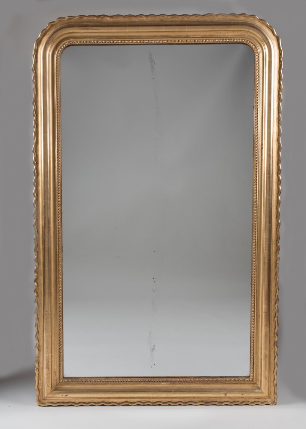 Late 19th century French gilt overmantle mirror with its original glass