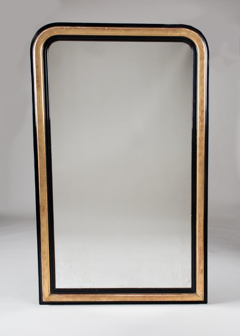 Unusual French ebonised and gilt overmantle mirror with gilt etched decoration