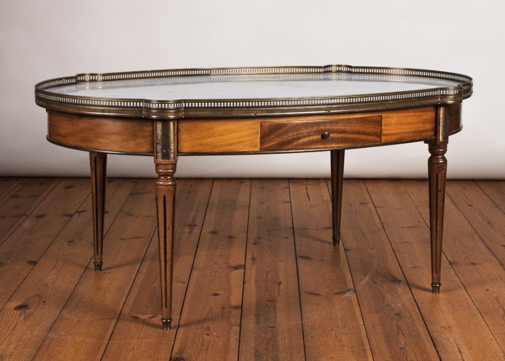 Large French walnut coffee table with brass fret and with a marble top