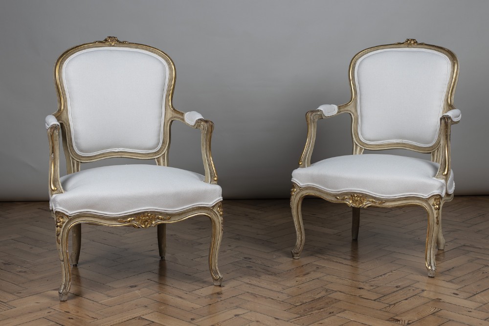 Pair Of French Louis XV Style Painted And Gilt Upholstered Cabriolet Armchairs