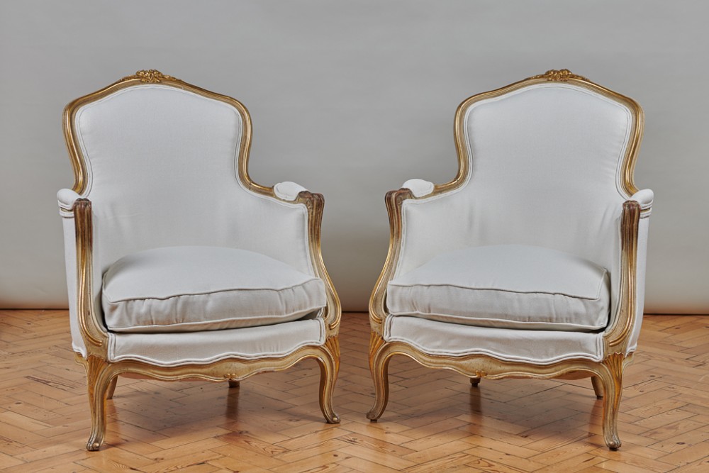 Pair Of Large French Louis XV Style Painted And Gilt Upholstered Bergere Armchairs