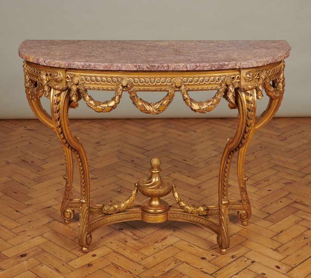 19th Century Large French Louis XVI Style Gilt Carved Wood Console Table With A Marble Top.