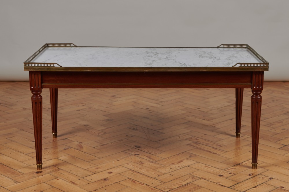 A Large French Walnut Coffee Table With Inserted Marble Top And Brass Gallery.