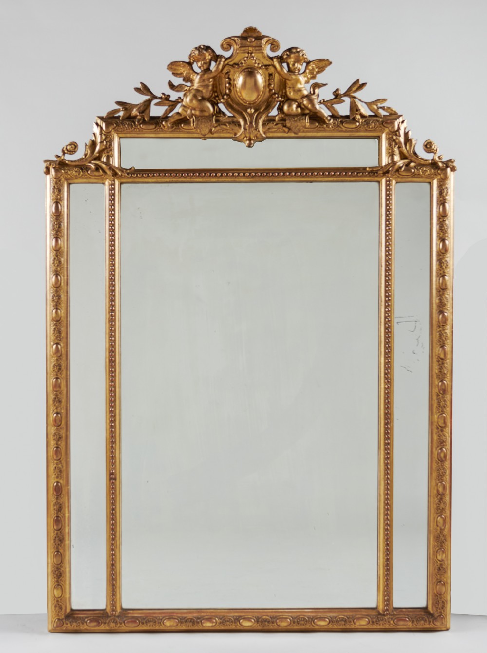 A 19th Century French Large Gilt Overmantle Mirror With Cherub Decoration.