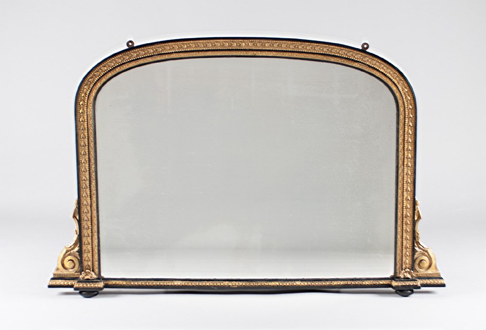 19th Century Large English Victorian Gilt And Ebonised Arch top Overmantle Mirror.