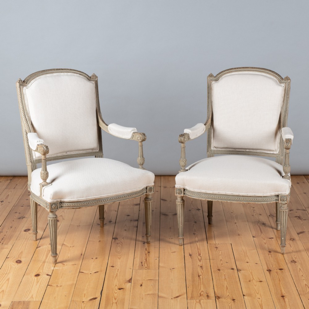 Pair Of French Louis XVI Style Painted upholstered Armchairs.