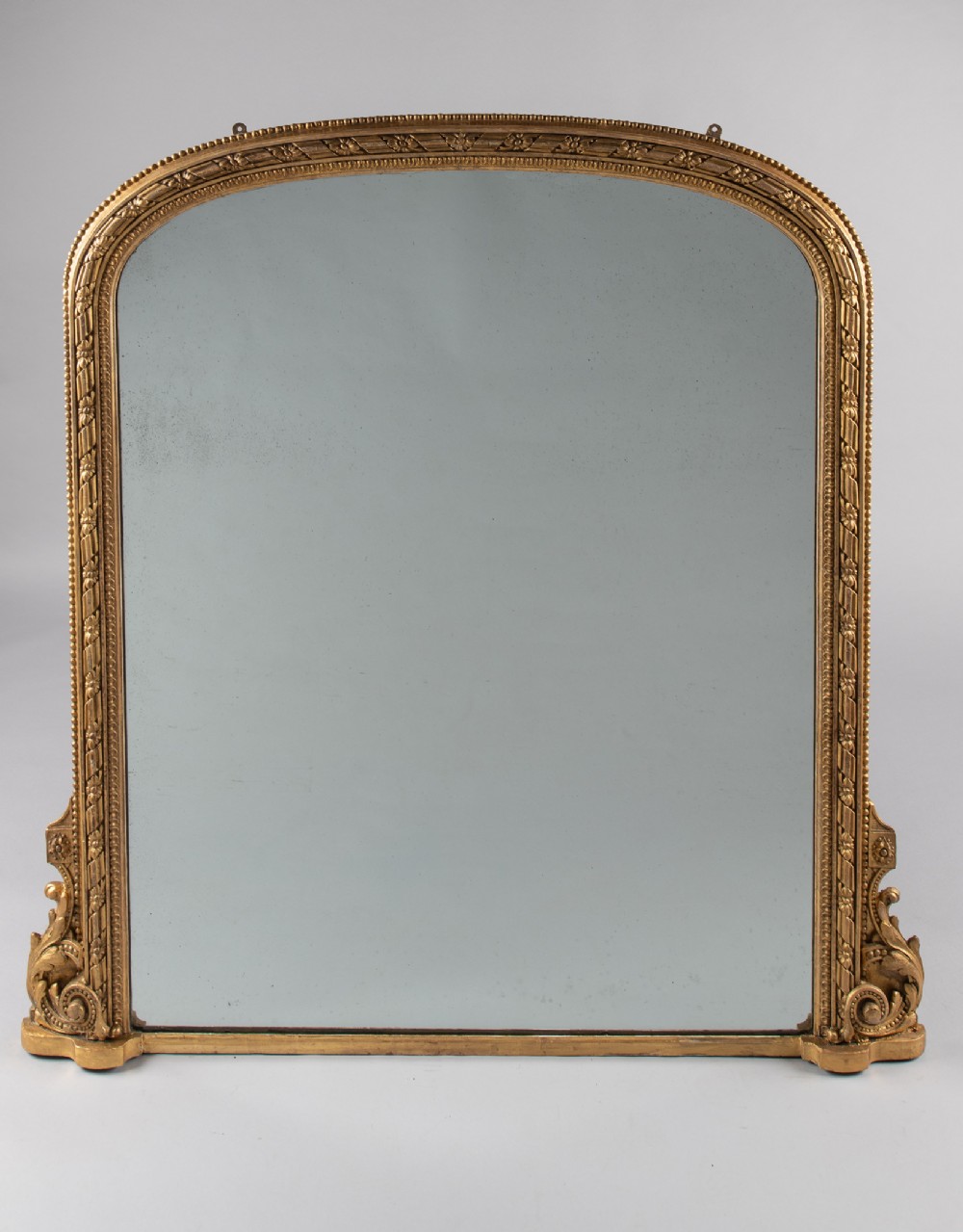 A Large English Victorian Gilt Archtop Overmantle Mirror