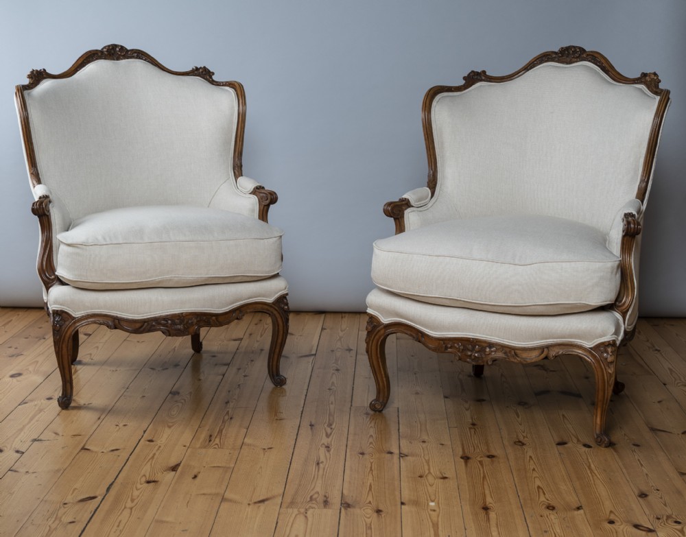 Pair Of Large French Louis XV Style Carved Walnut Upholstered Bergere Armchairs