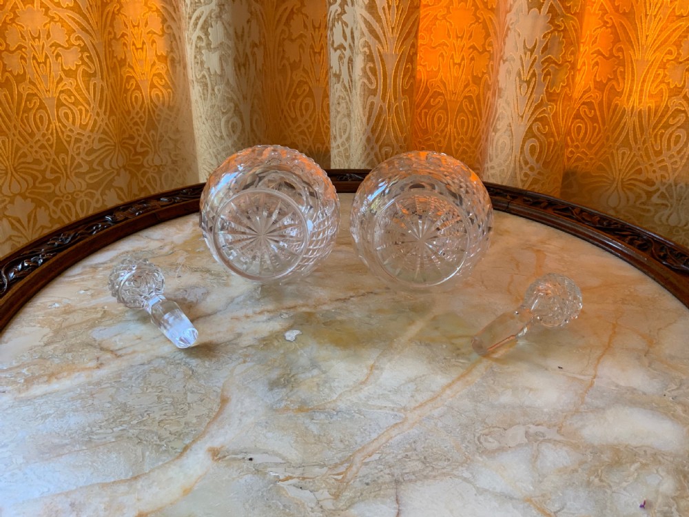 A clear Georgian cut glass decanter featuring three neck rings, a diamond cut band, and a matching mushroom-shaped faceted stopper. View V