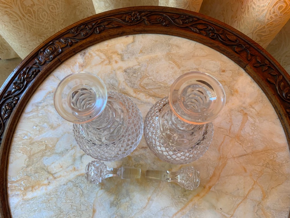 A clear Georgian cut glass decanter featuring three neck rings, a diamond cut band, and a matching mushroom-shaped faceted stopper. View VIII
