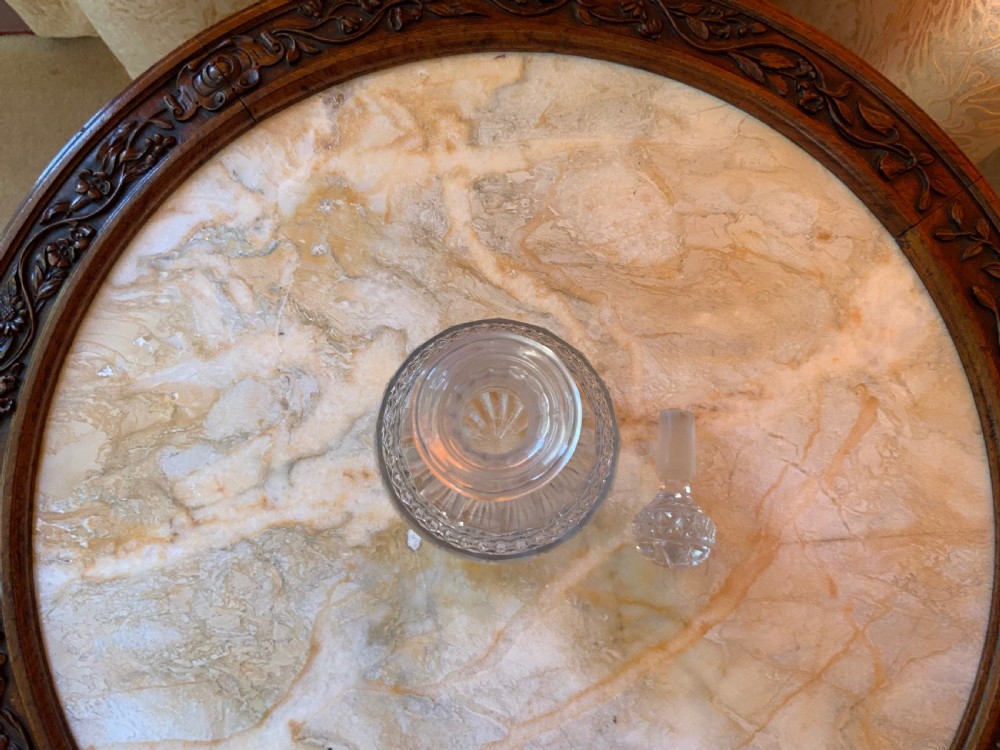 A clear Georgian cut glass decanter featuring three neck rings, a diamond cut band, and a matching mushroom-shaped faceted stopper. View X
