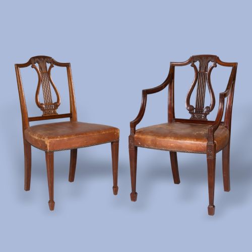 A SET OF TEN CARVED DINING CHAIRS IN THE NEOCLASSICAL MANNER - ADDITIONAL PHOTO 1