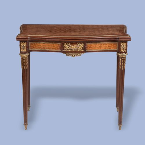 AN ORMOLUMOUNTED PARQUETRY CARD TABLE IN THE LOUIS XVI STYLE - ADDITIONAL PHOTO 1