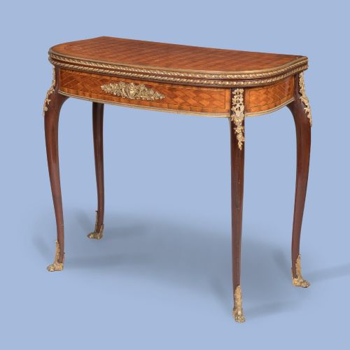 AN ORMOLUMOUNTED PARQUETRY CARD TABLE ATTRIBUTED TO FRANOIS LINKE