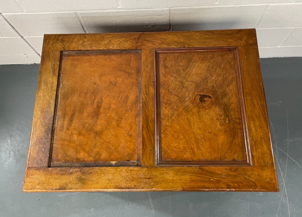 A low antique walnut chest of drawers featuring three full-width drawers with decorative cast metal handles and a panelled top. View IV