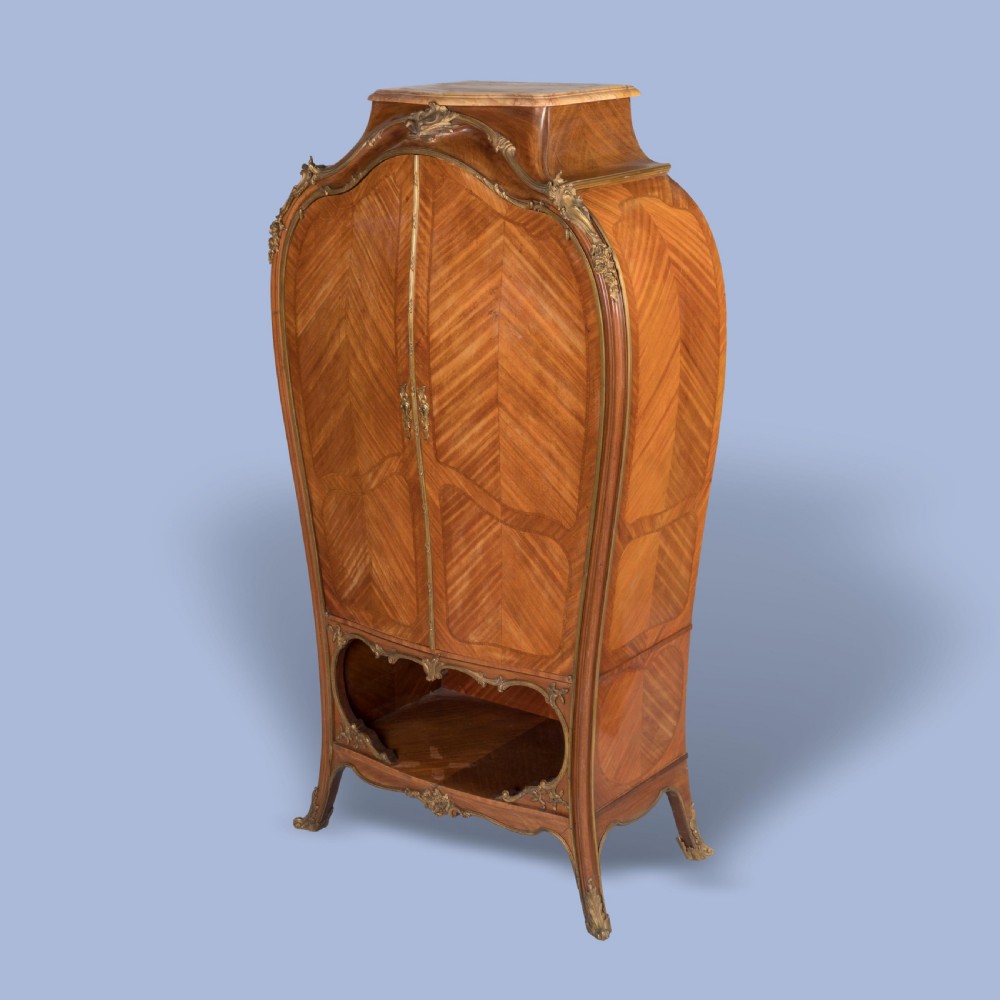A LATE 19TH CENTURY ORMOLU-MOUNTED BOMBÉ CABINET