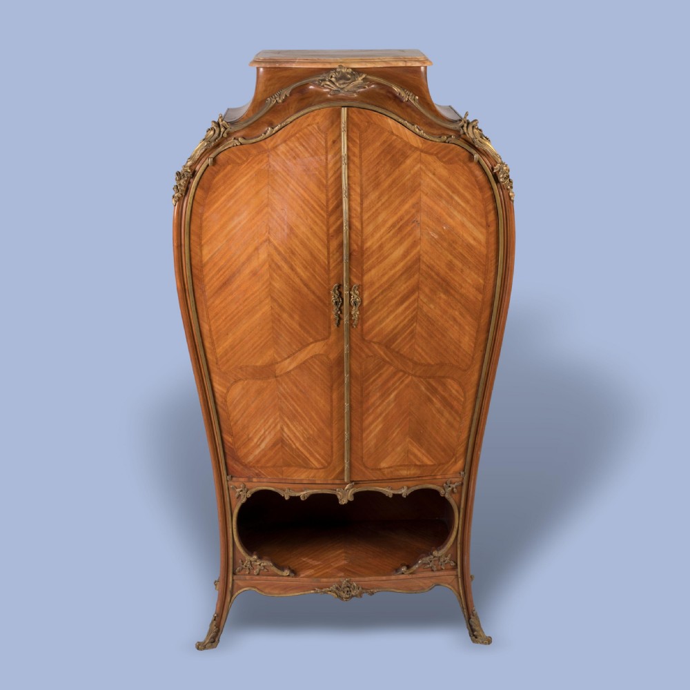 A LATE 19TH CENTURY ORMOLU-MOUNTED BOMBÉ CABINET View II