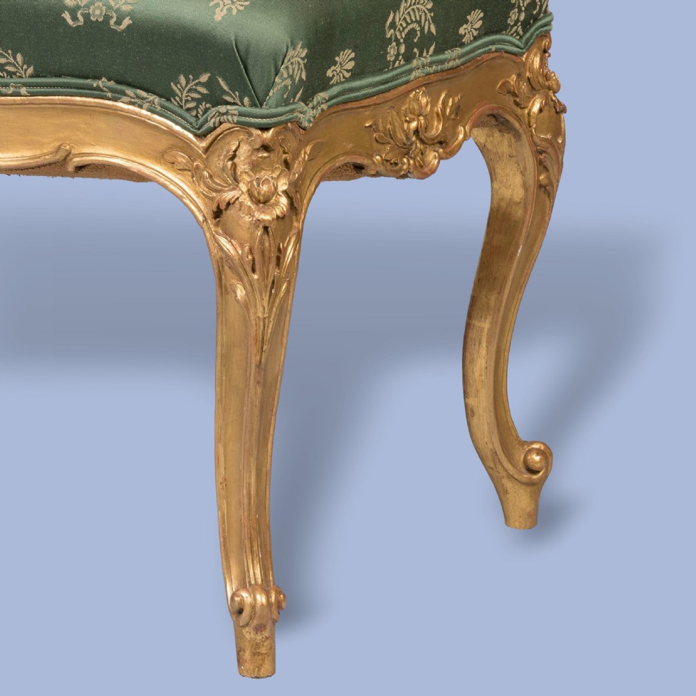 A FINE PAIR OF GILTWOOD FOOTSTOOLS IN THE LOUIS XV MANNER View V
