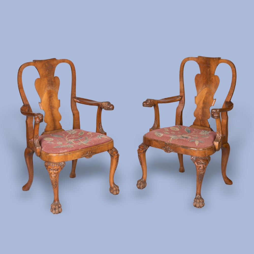 A PAIR OF GEORGE I STYLE WALNUT LOWBACK OPEN ARMCHAIRS