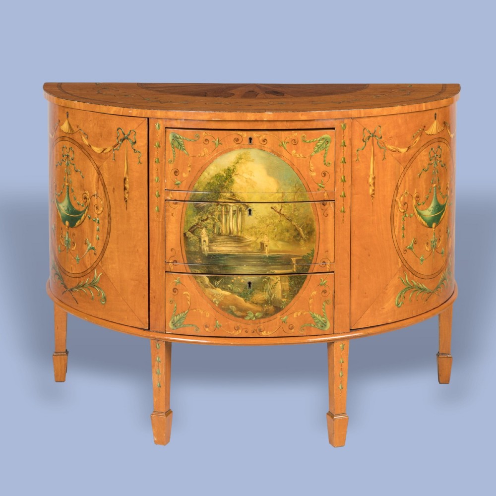 A SATINWOOD COMMODE IN THE MANNER OF THE ADAMS BROTHERS