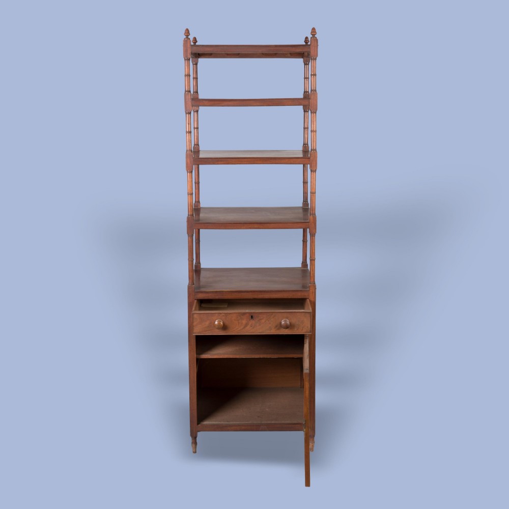 A tall George IV mahogany whatnot featuring four open tiers supported by turned columns above a single drawer and base cupboard. View III