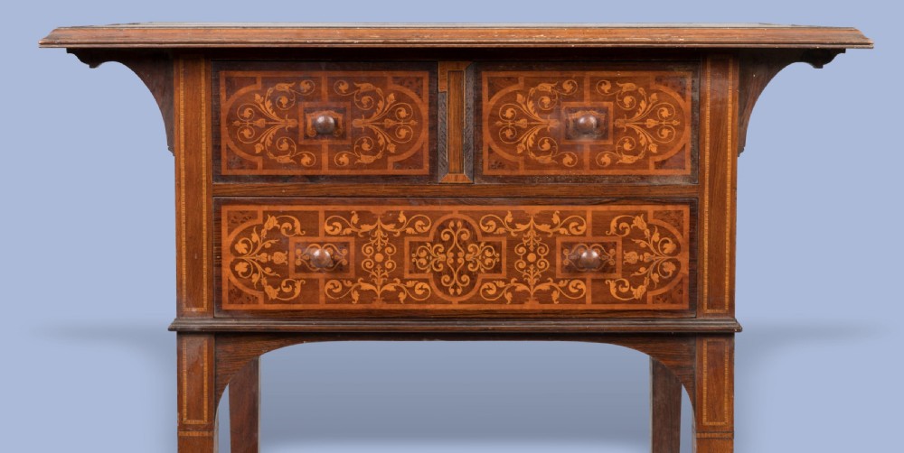 An Aesthetic Movement dark wood side table with detailed floral marquetry inlays on the drawers and slender curved legs. View V