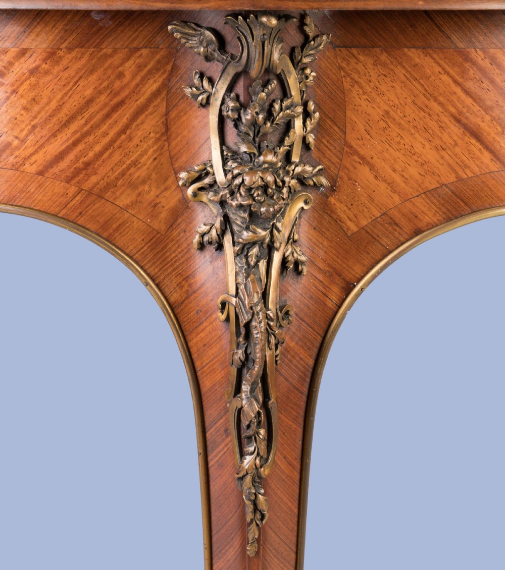 A French Louis XV style demilune kingwood card table featuring curved cabriole legs, intricate parquetry veneer, and decorative gilt-bronze mounts. View VI
