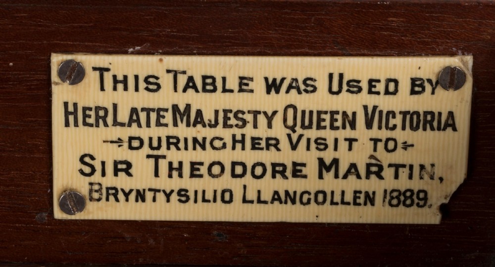 An ornate 19th-century French style marquetry writing table featuring a green leather top, gilt-bronze mounts, and scrolled end supports. View IV