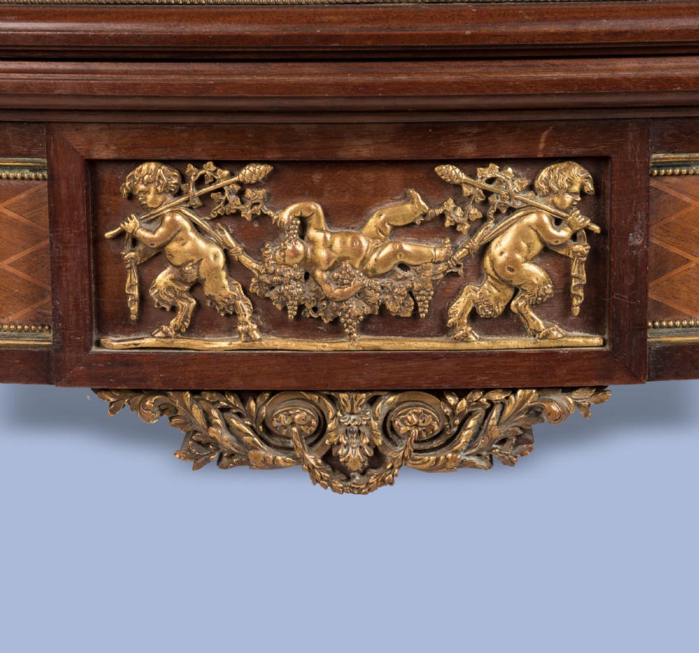 A rectangular Louis XVI style card table featuring geometric parquetry wood veneers, fluted tapering legs, and gilded ormolu mounts. View IV