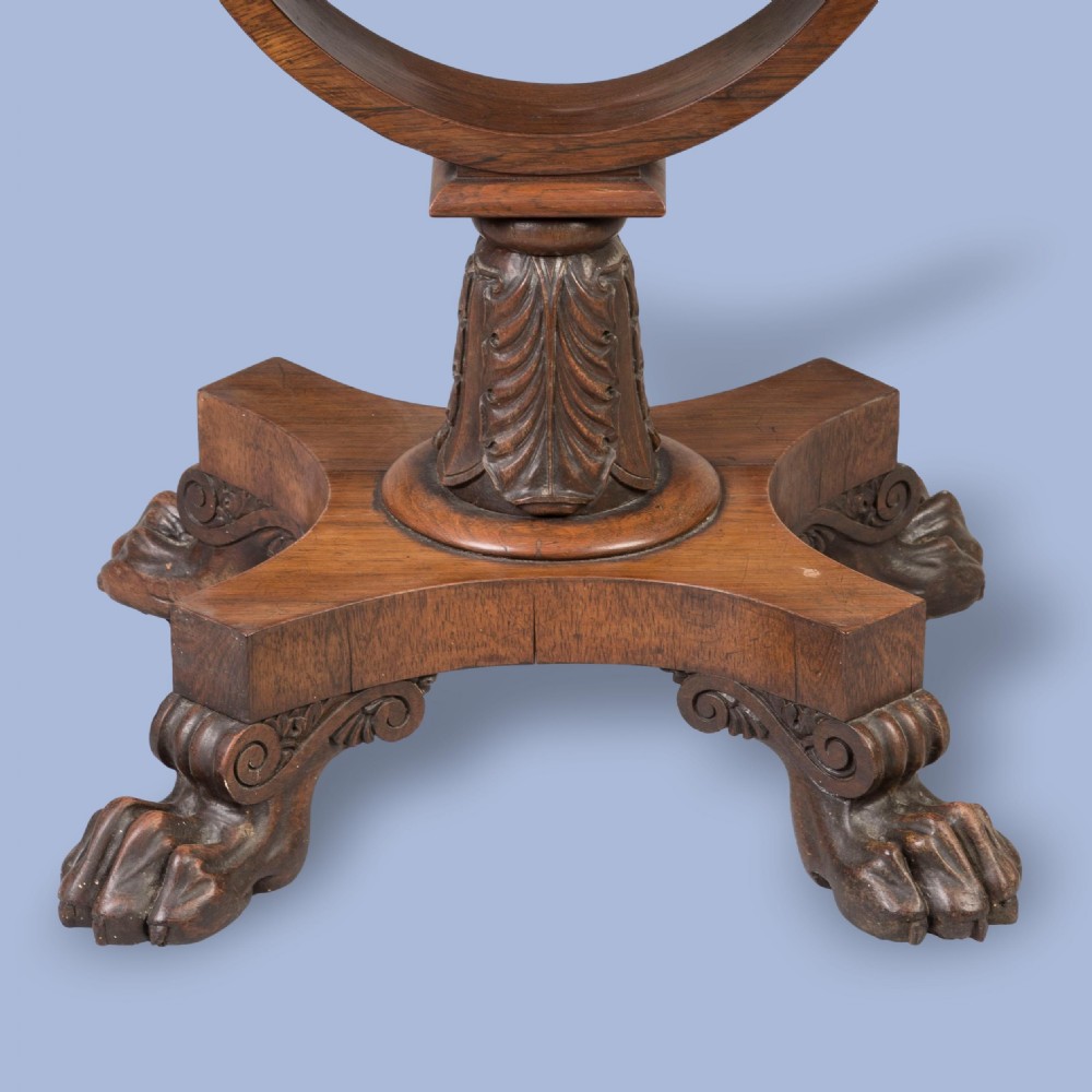 A William IV rosewood drop-leaf table with a fabric-covered work basket, U-shaped support, and carved claw feet. View II