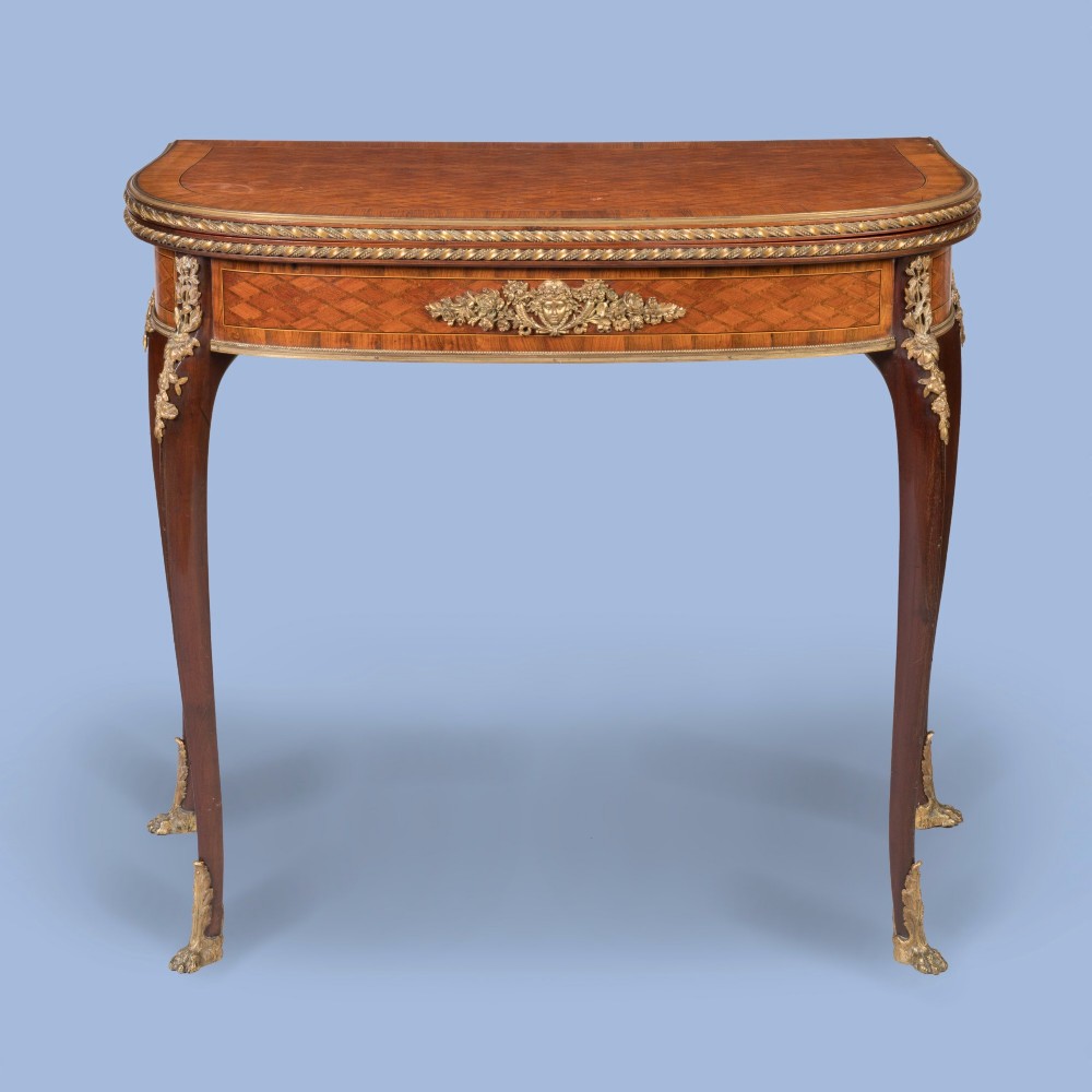 A French-style parquetry card table with cabriole legs and gilded bronze mounts on the apron and feet. View II
