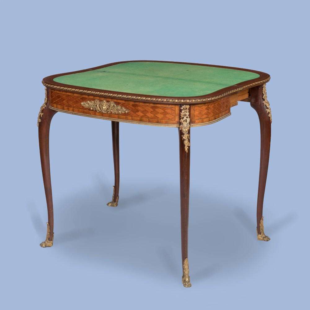 A French-style parquetry card table with cabriole legs and gilded bronze mounts on the apron and feet. View V
