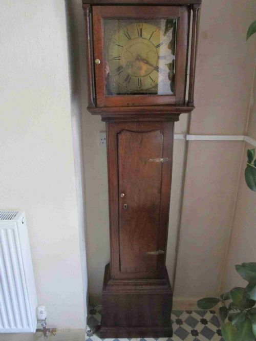Brass dial oak longcase clock