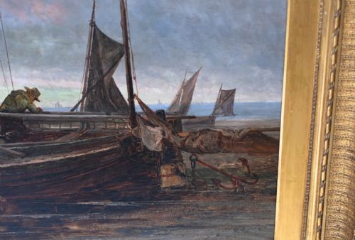 fig 2. A large Victorian oil painting on canvas depicting fishermen and boats along a coastal shore beneath a cloudy sky, presented in an ornate gilt frame.